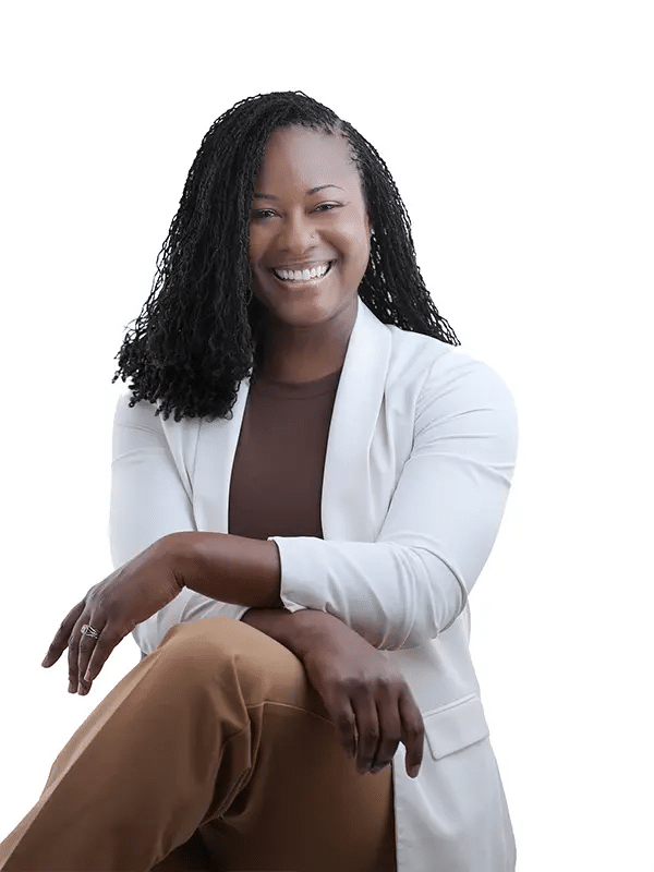 Guide To Headshots For Medical Professionals In Texas 5 Female doctor with long blonde hair, smiling, wearing a white coat.