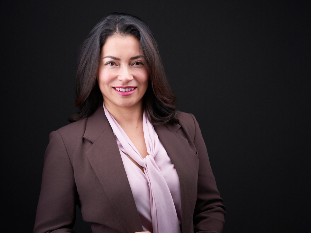 Event Headshot Booth For Corporate Events In San Antonio 28 A beautiful lady wearing a dark brown coat giving a smile