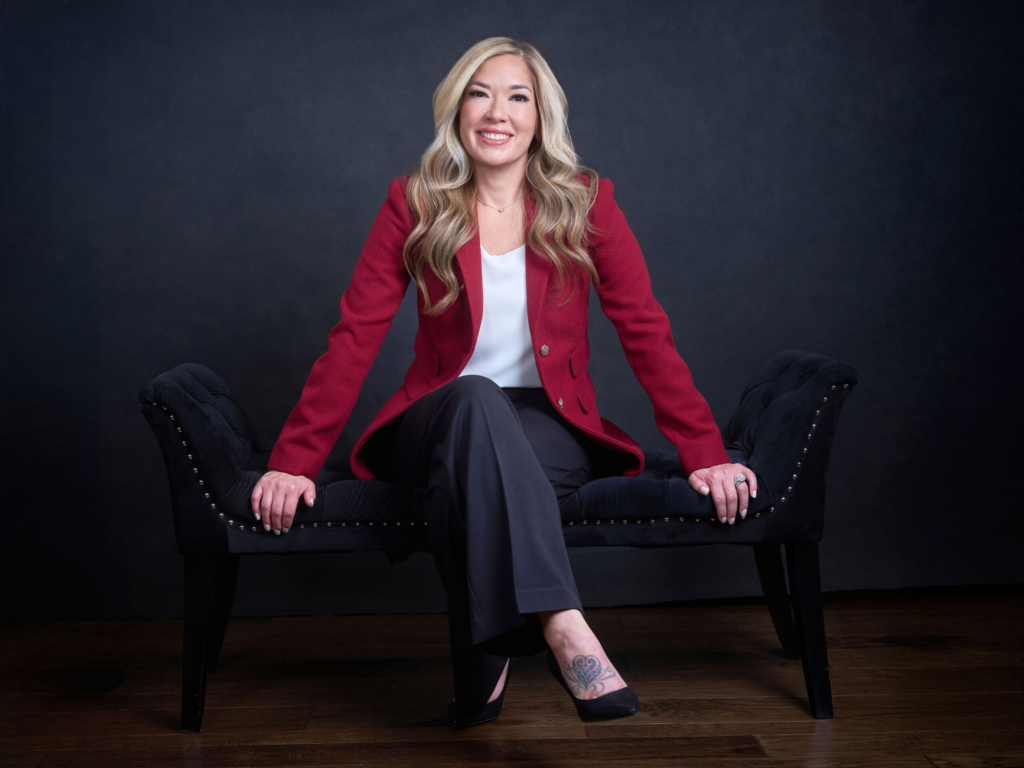 How Strong Brand Photography Helps Clients Choose You 27 Woman in a red blazer seated on a black bench