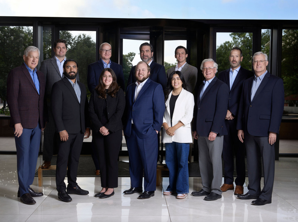 How to Prepare for Corporate Headshots at Your Next Conference or Company Event 28 Professional corporate team portrait of eleven business professionals standing together inside a modern office.
